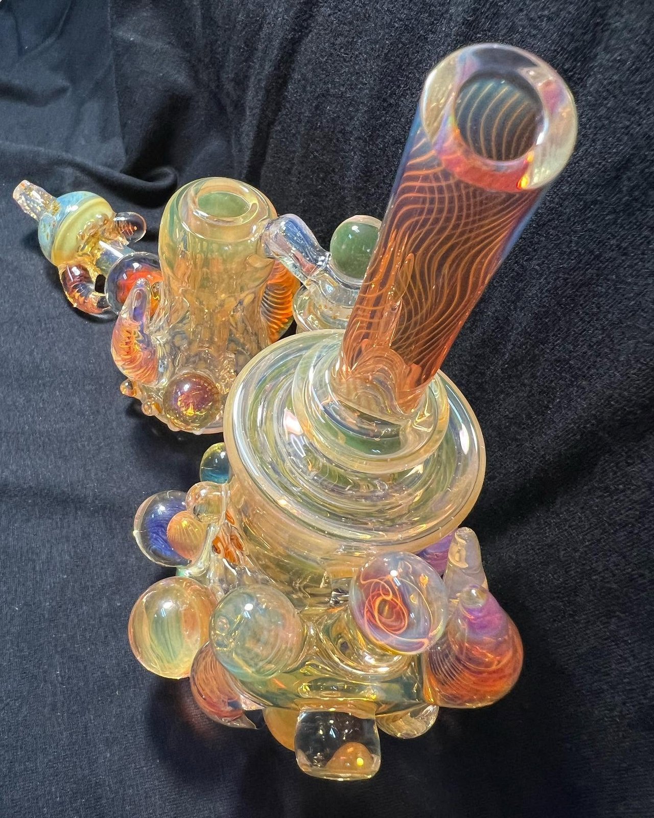 Two fumed glass pieces with marbles, in the shop